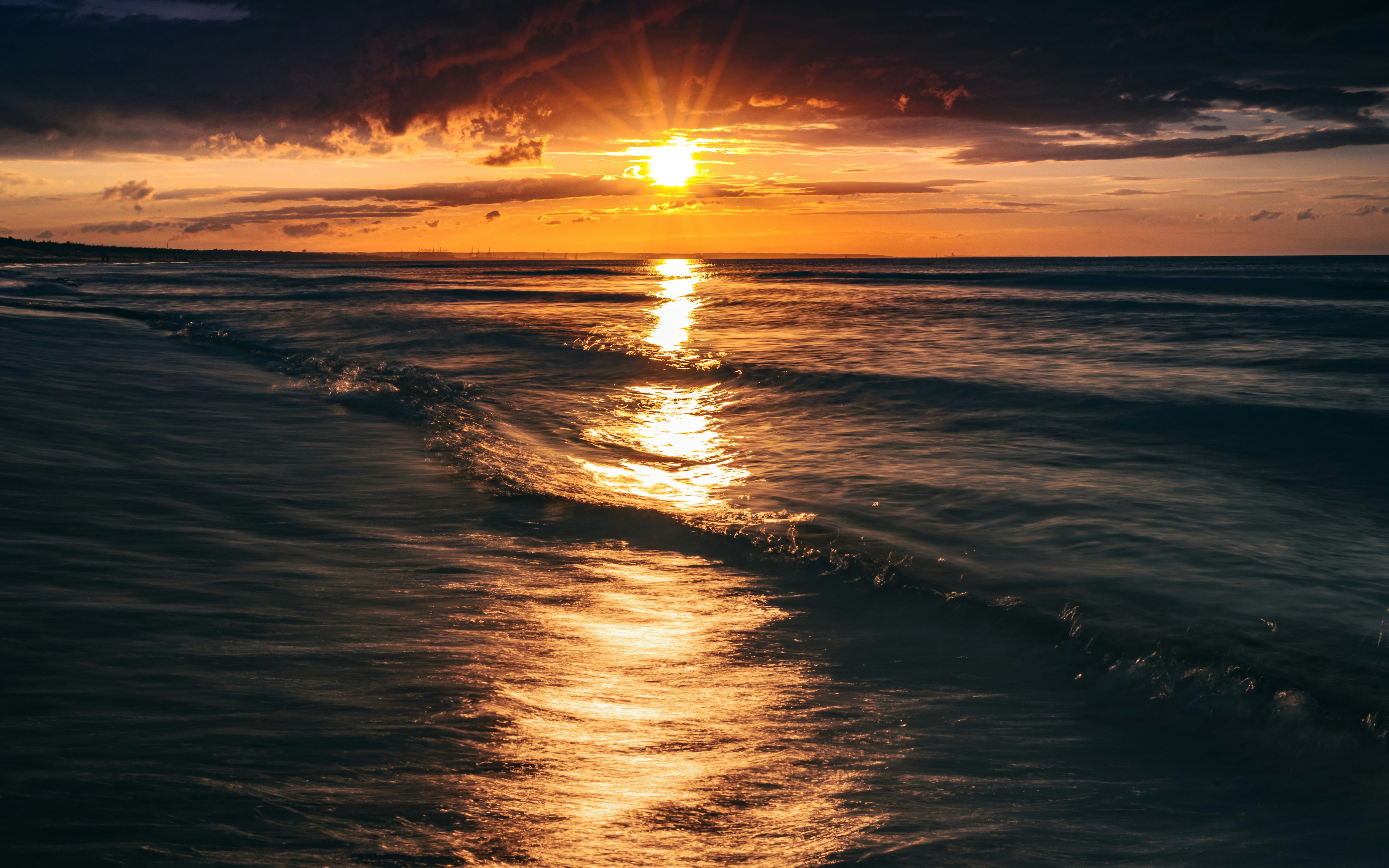 body of water during sunset